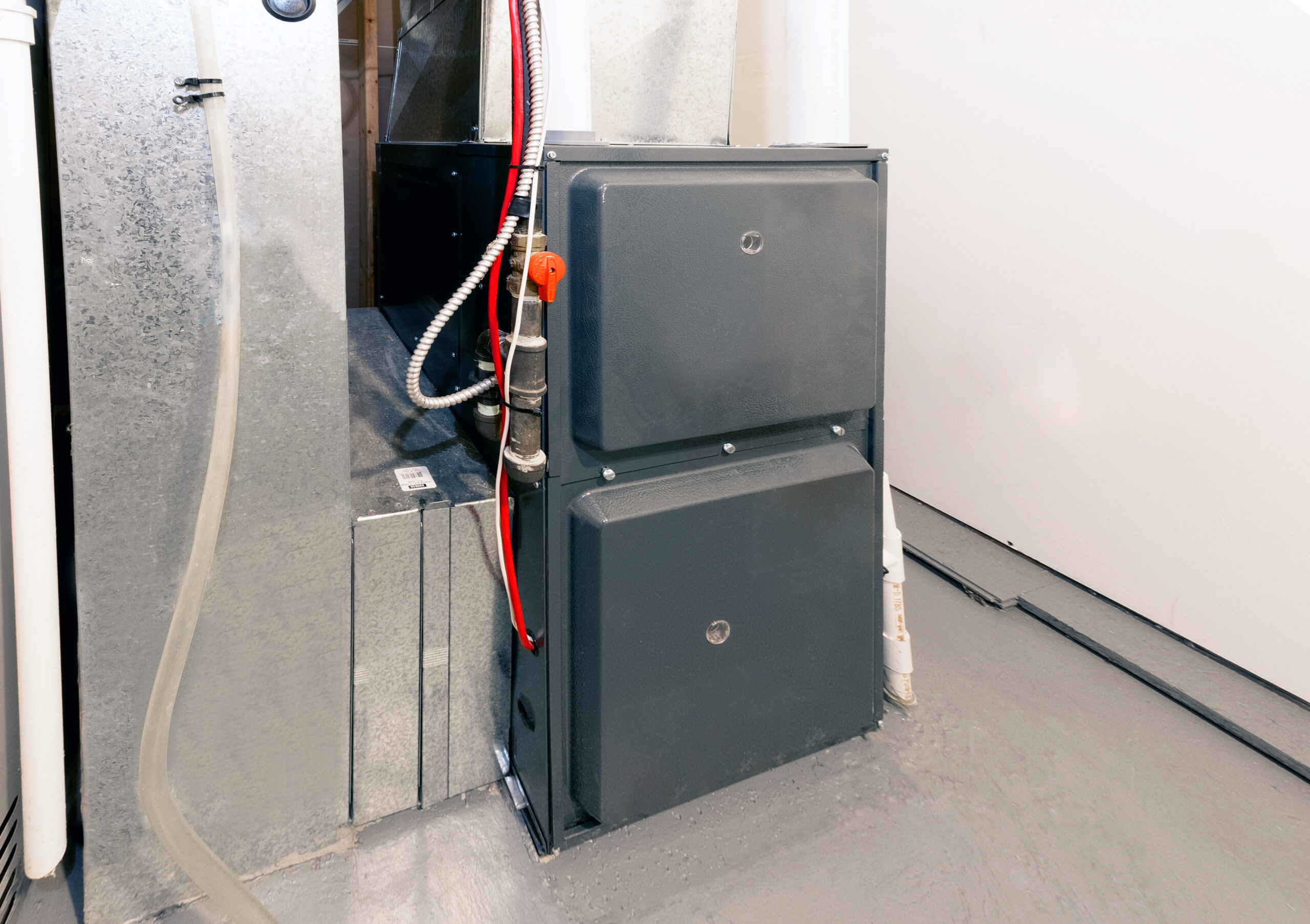 Gas furnace installation in a residential setting, highlighting energy-efficient heating solutions for winter comfort.