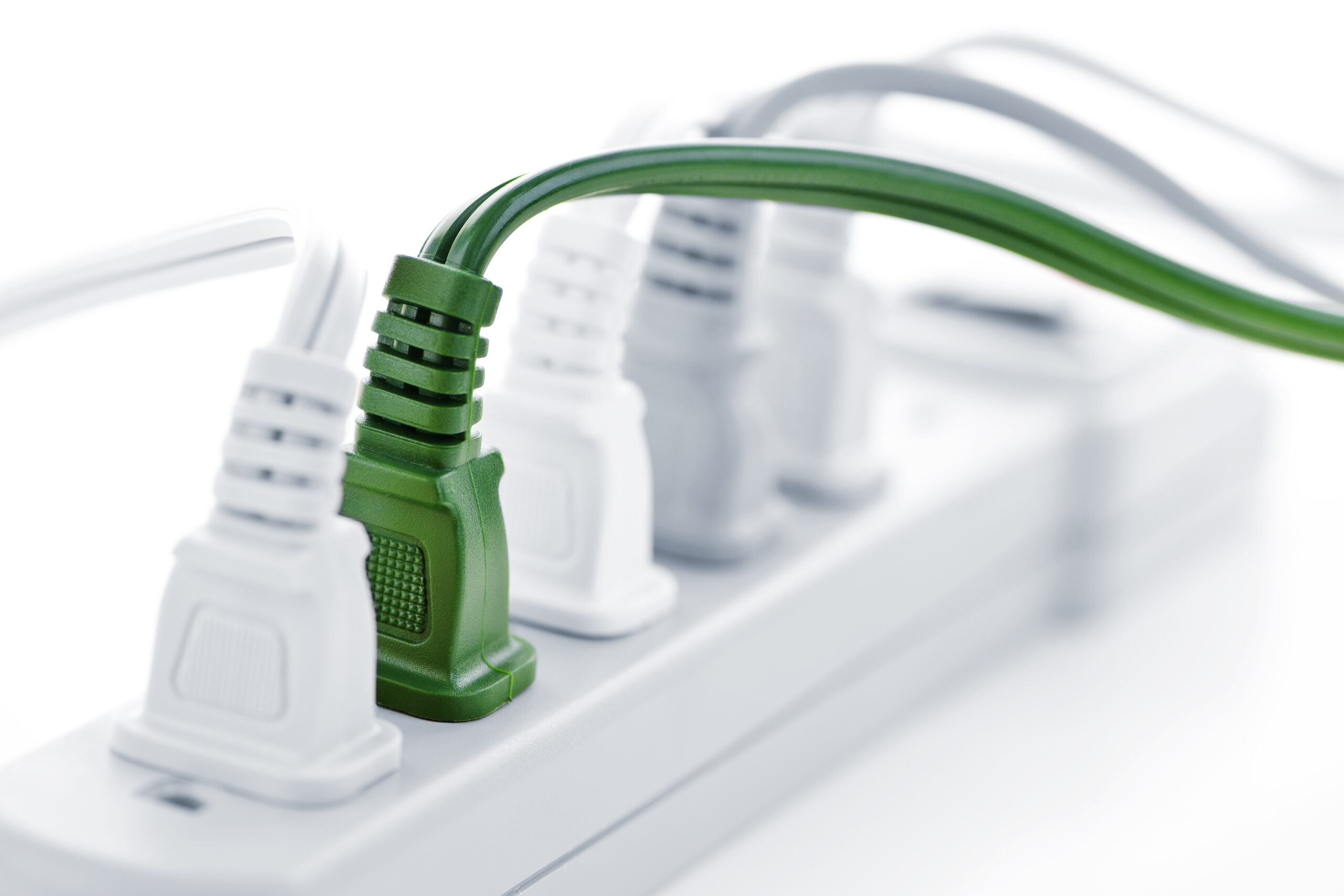 Surge protector with multiple outlets and a green power cord, emphasizing electrical safety and device protection.