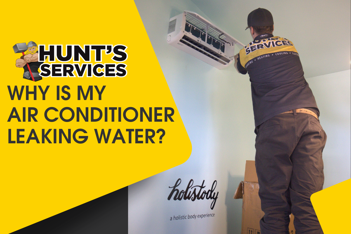 Technician from Hunt's Services inspecting air conditioner for water leakage, with a focus on HVAC maintenance and repair, set against a bright yellow background featuring the company logo.