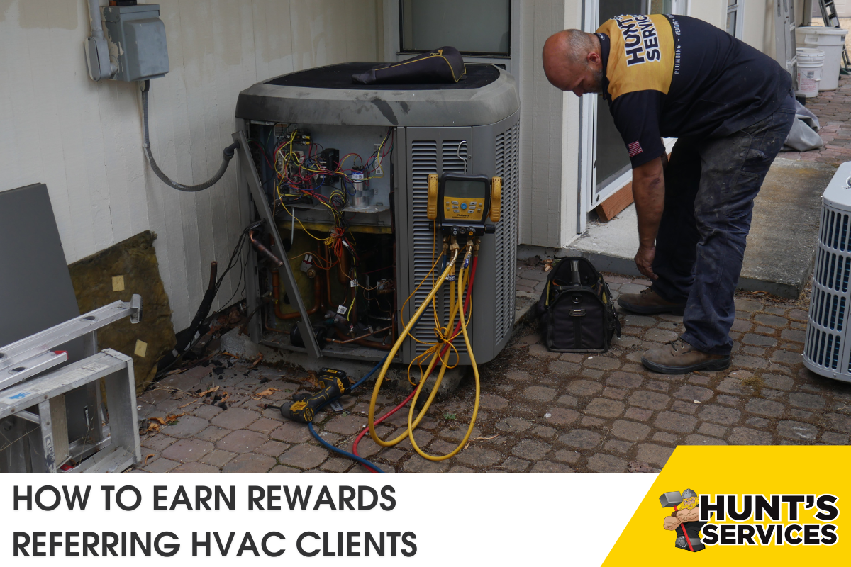 Technician working on HVAC unit with tools, promoting Hunt's Services referral program for rewarding clients who refer HVAC services.